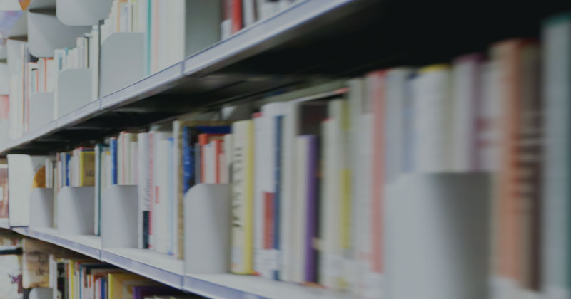 Shelf of books and files for accountancy and business advice